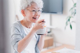 Woman enjoying a bowl of yogurt